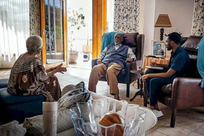 Our Editor David Wamambo chats with Dr Theo-Ben Gurirab and his wife Joan Guriras. Picture by: Enzo Jantjies